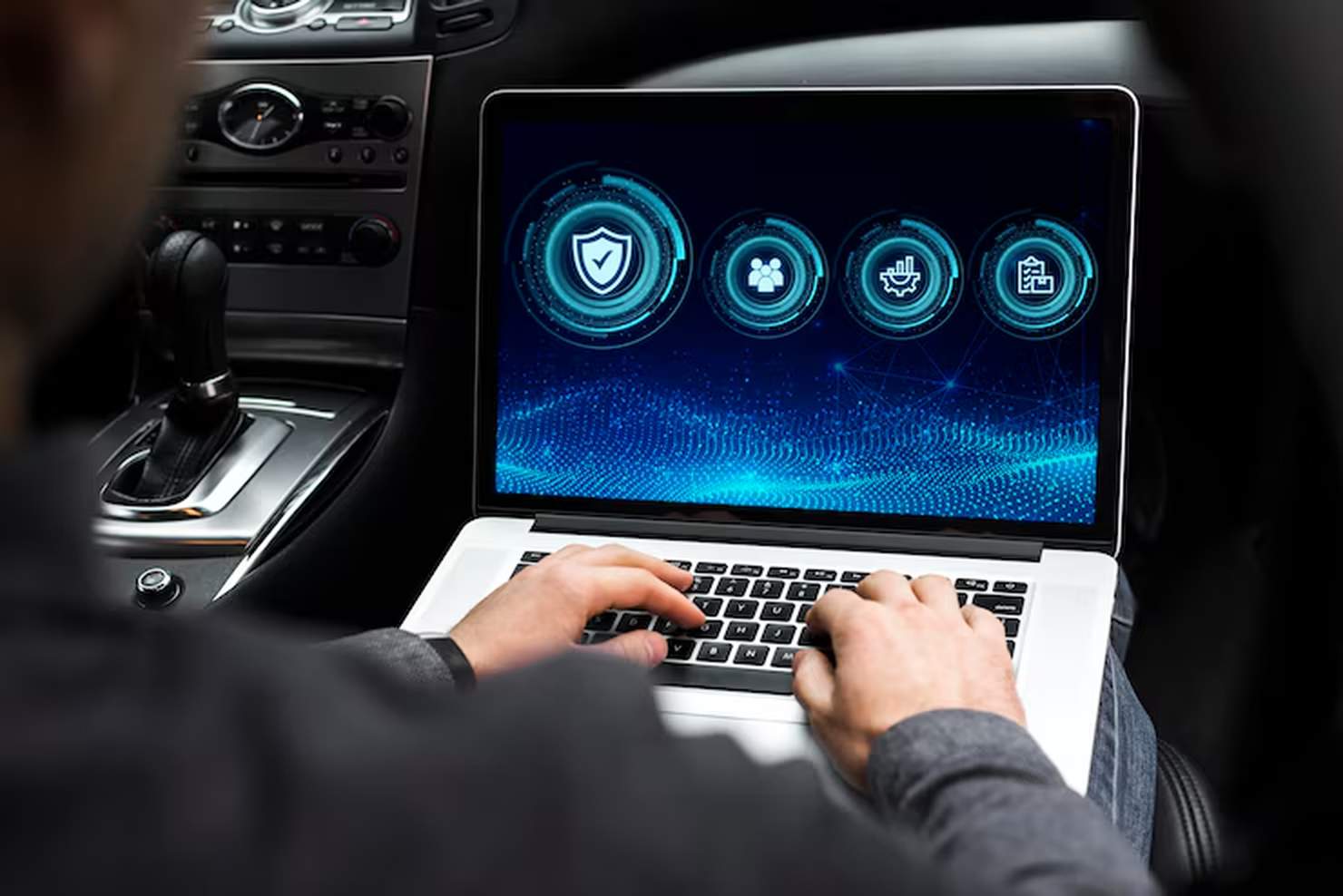 A person using a laptop inside a car, with a futuristic digital interface displayed on the screen, symbolizing the use of Artificial Intelligence to assess vehicle financing and related data analytics.